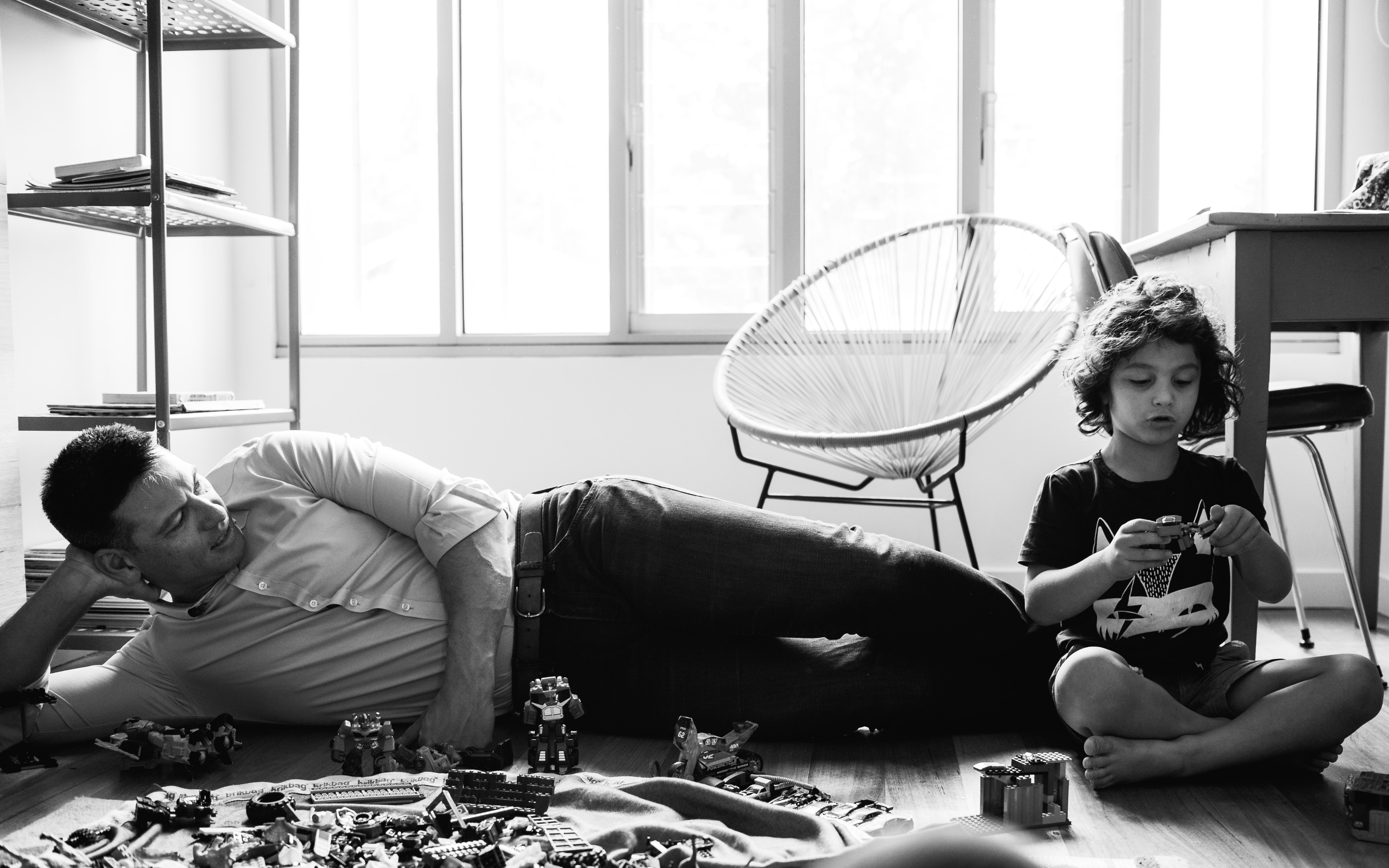 photograph of father and his boy creating and building with Lego in their bedroom in Carlton North, Melbourne, Australia