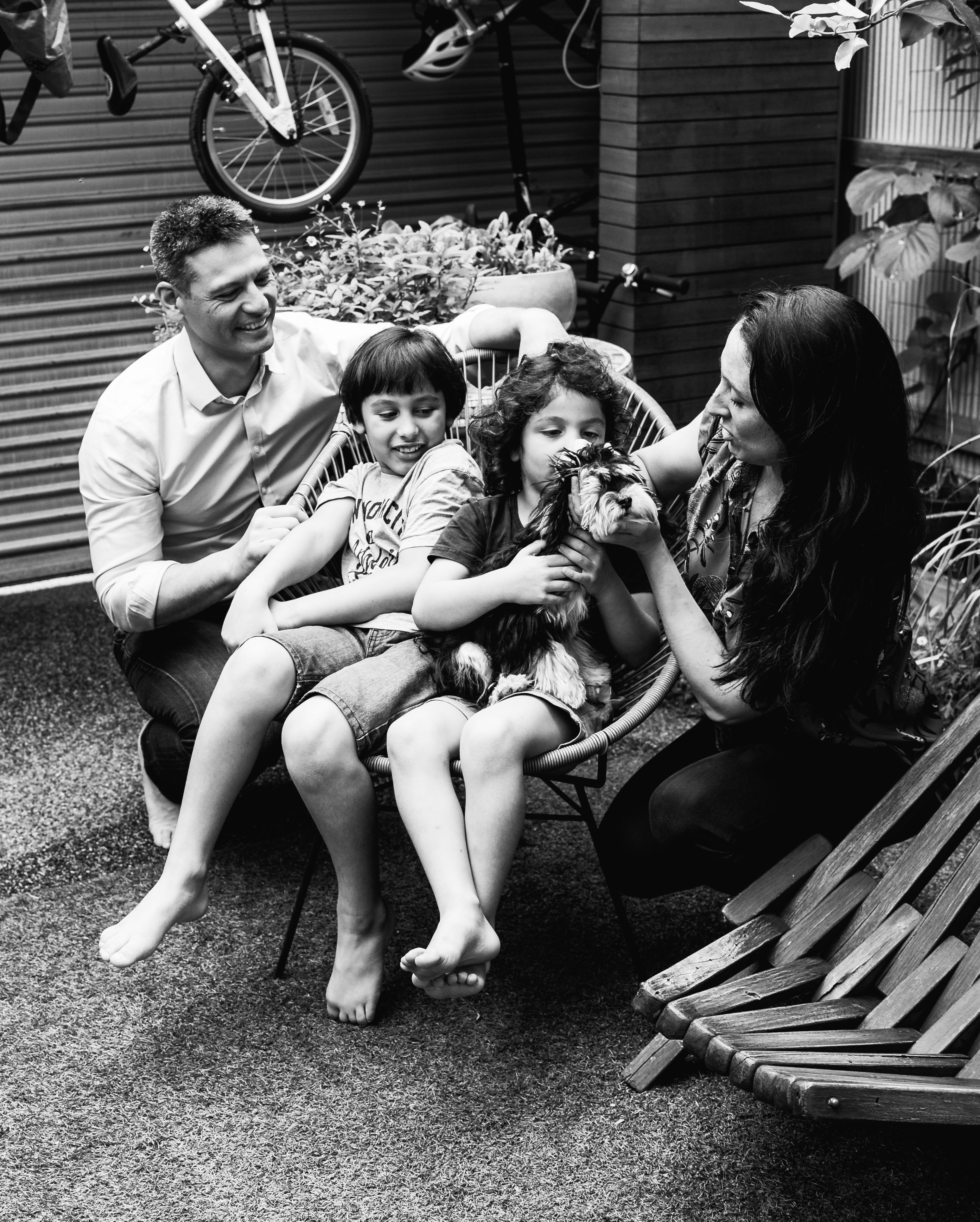 photograph of a family sitting in their backyard in Carlton North, Melbourne, Australia