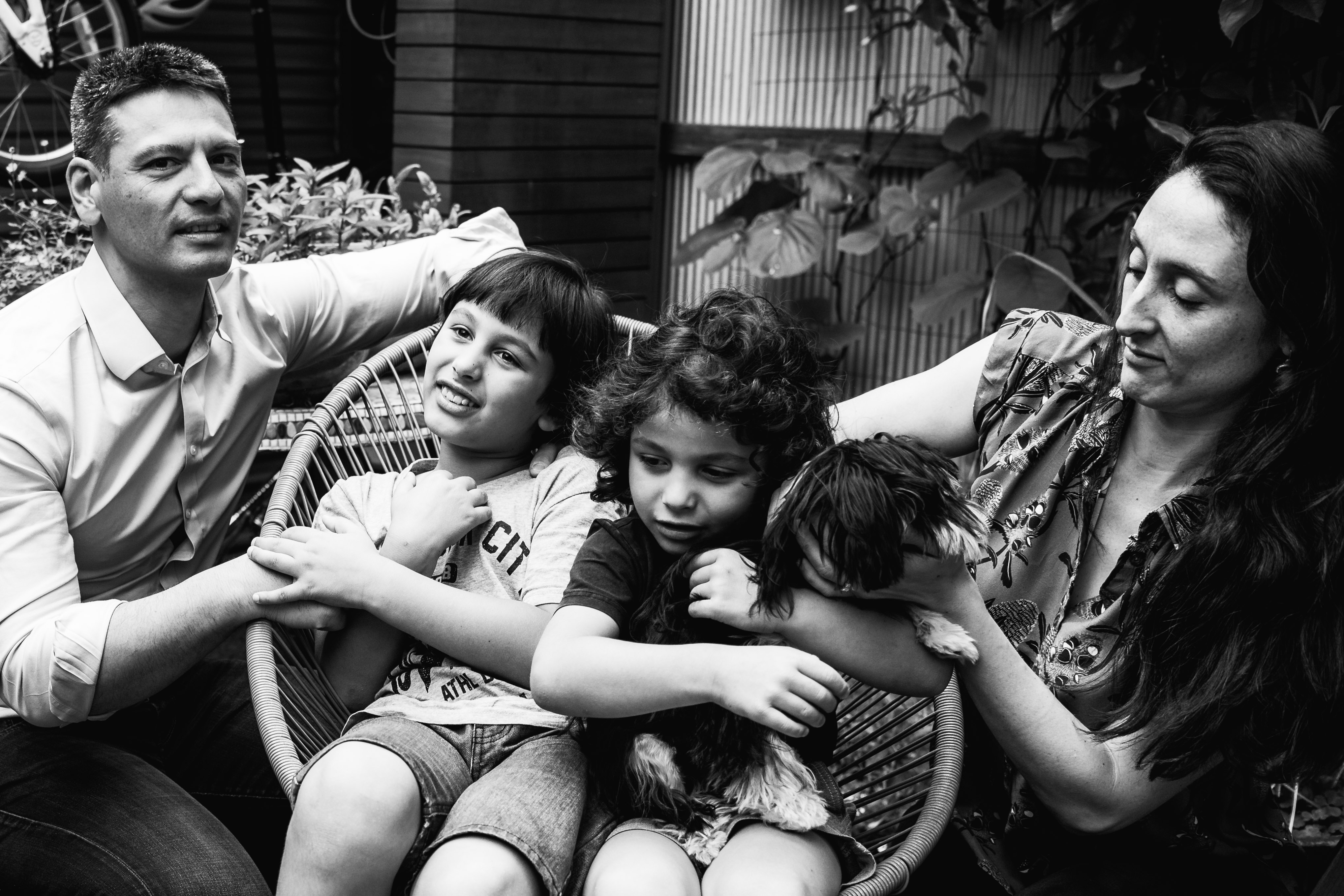 photograph of a family sitting in their backyard in Carlton North, Melbourne, Australia