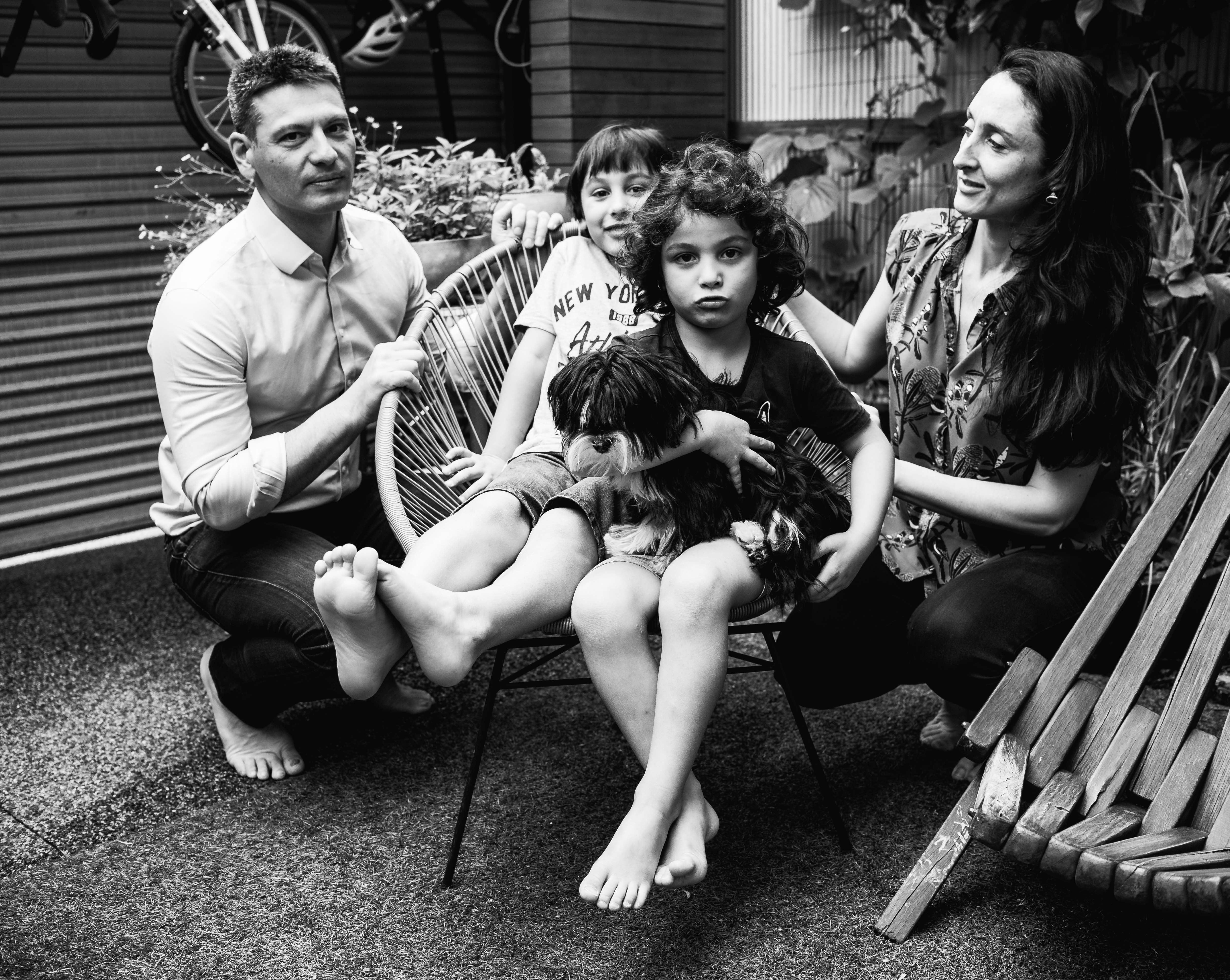 photograph of a family sitting in their backyard in Carlton North, Melbourne, Australia