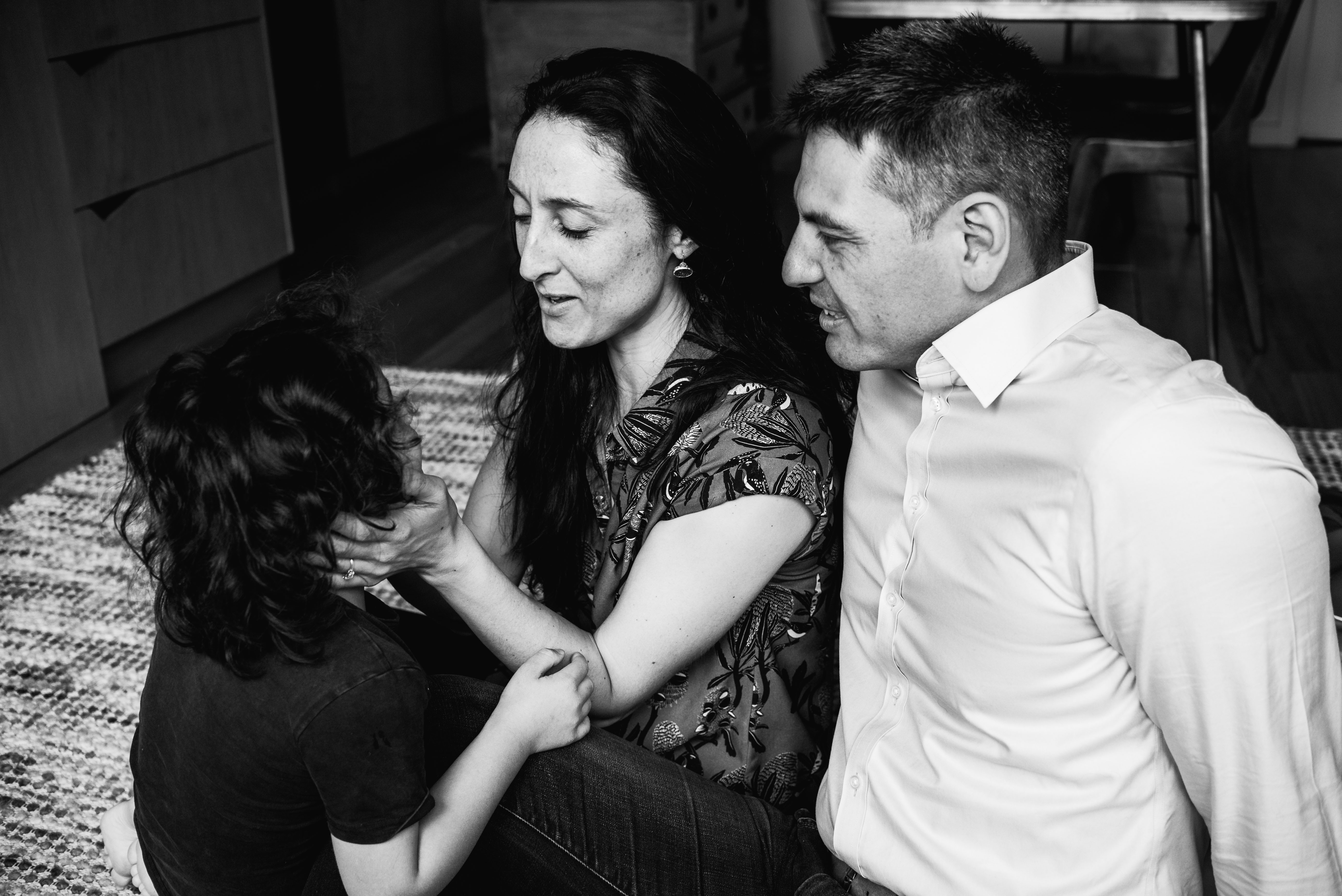 photograph of parents talking to their son in Carlton North, Melbourne, Australia