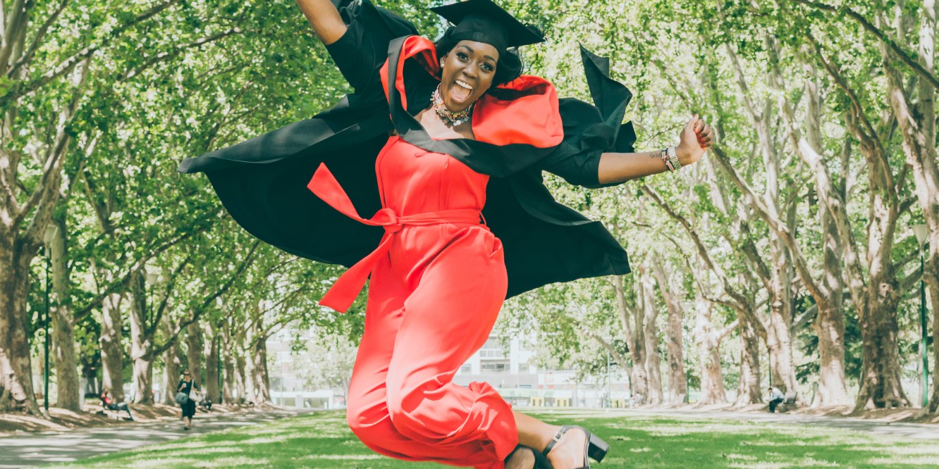 Graduate jumps in excitement as Liyat G Haile Photography captures the action