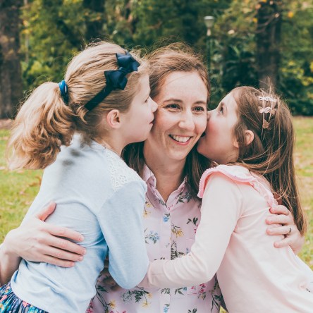 Portrait of children kissing their mother in Melbourne, Australia