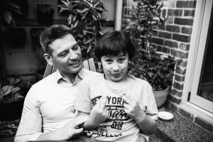 funny photograph of a boy and his father in Carlton North, Melbourne, Australia