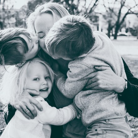 Portrait of mother and children hugging in Melbourne, Australia