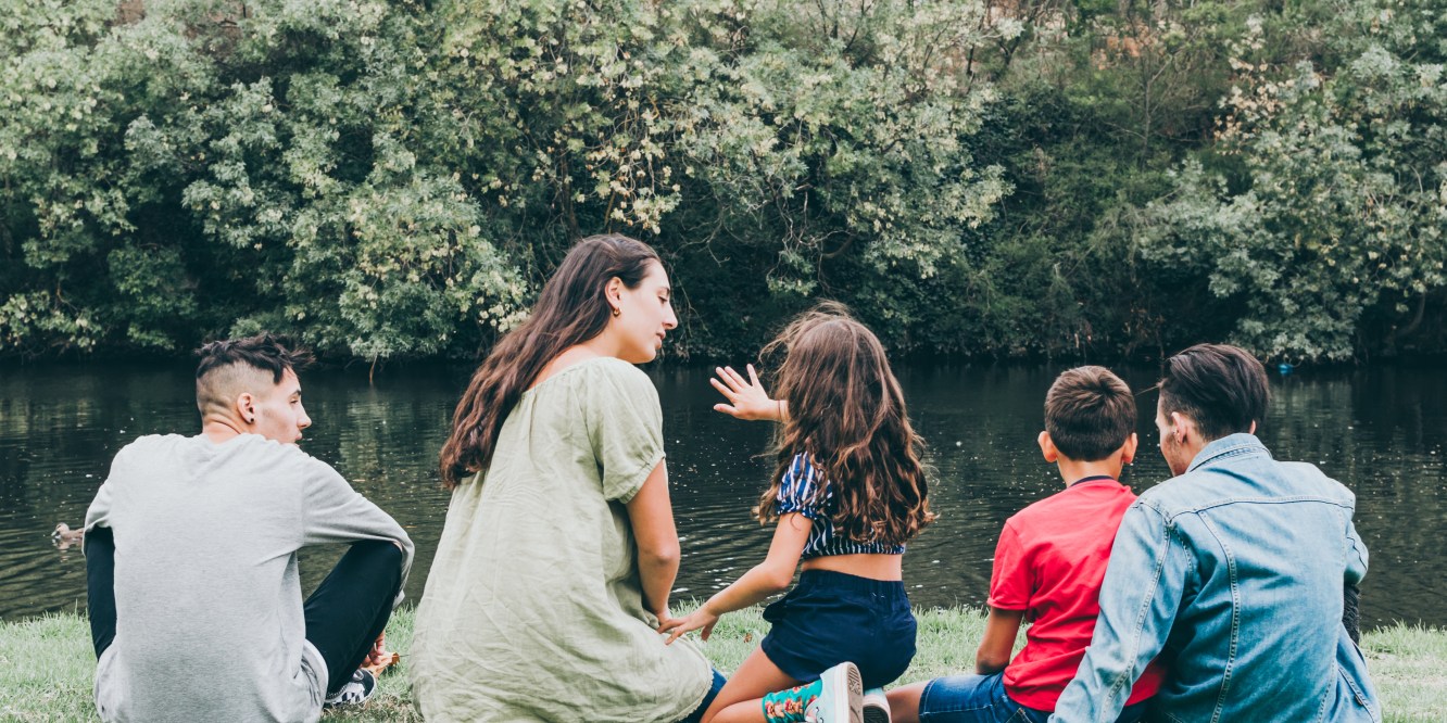 Melbourne Lifestyle photographer Liyat G Haile documents and captures children sitting by Coburg Lake Reserve in Melbourne, Victoria, Australia with nature, trees, water outdoor family photography